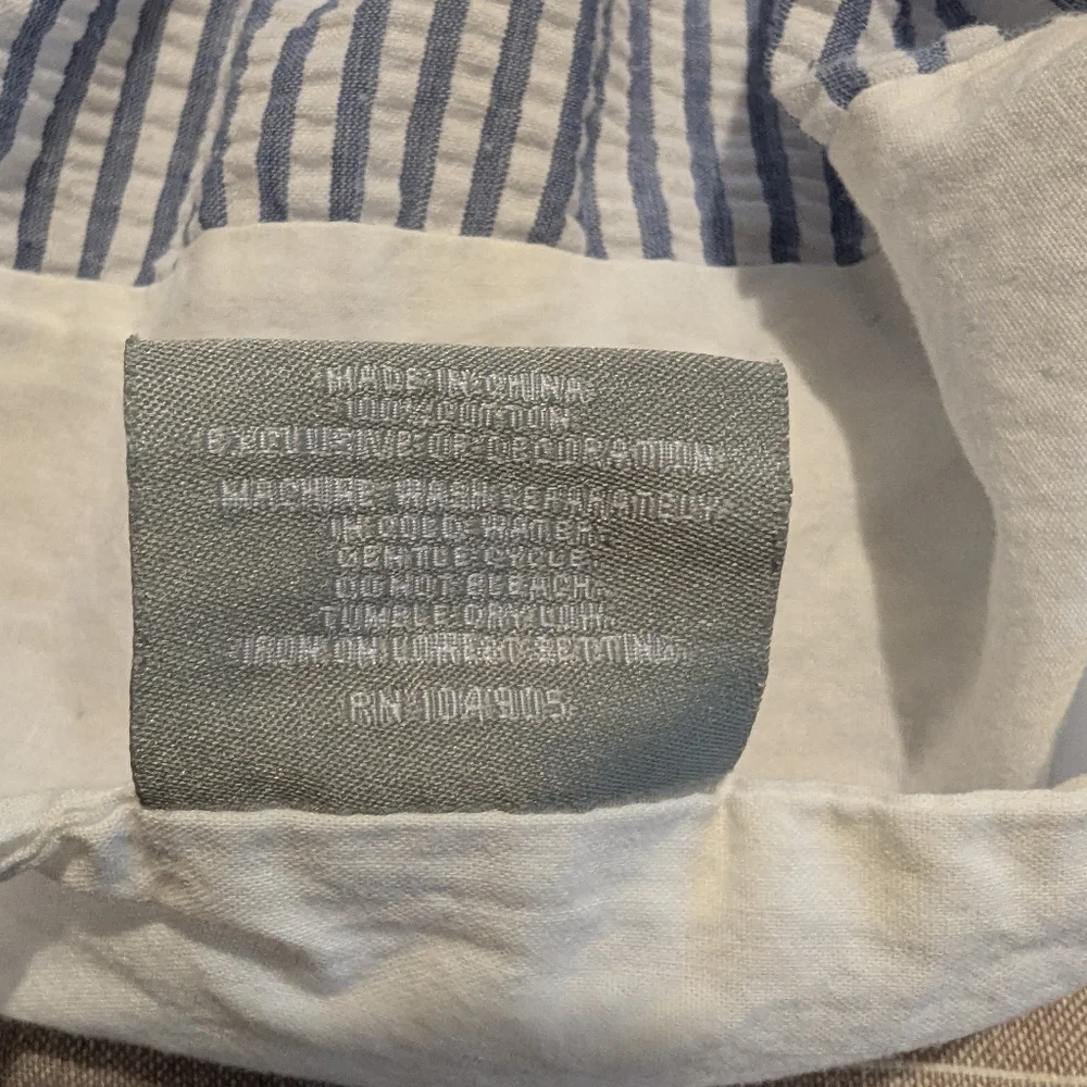 Pair of Nicole Miller embroidered seersucker cotton stripe shams